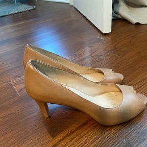 Cole Haan peep toe pump in beige leather.